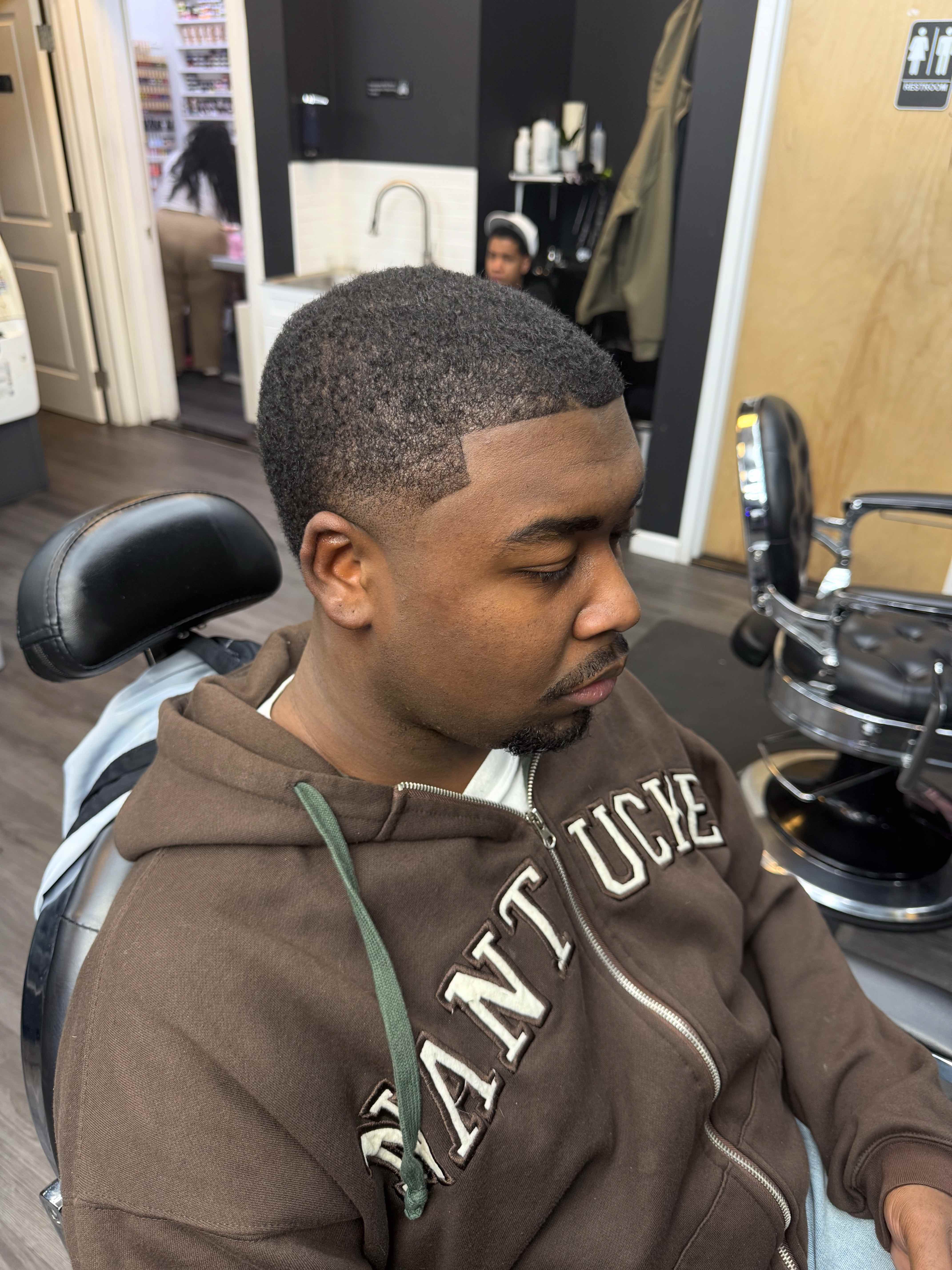Clean fade haircut result showing precision and detail