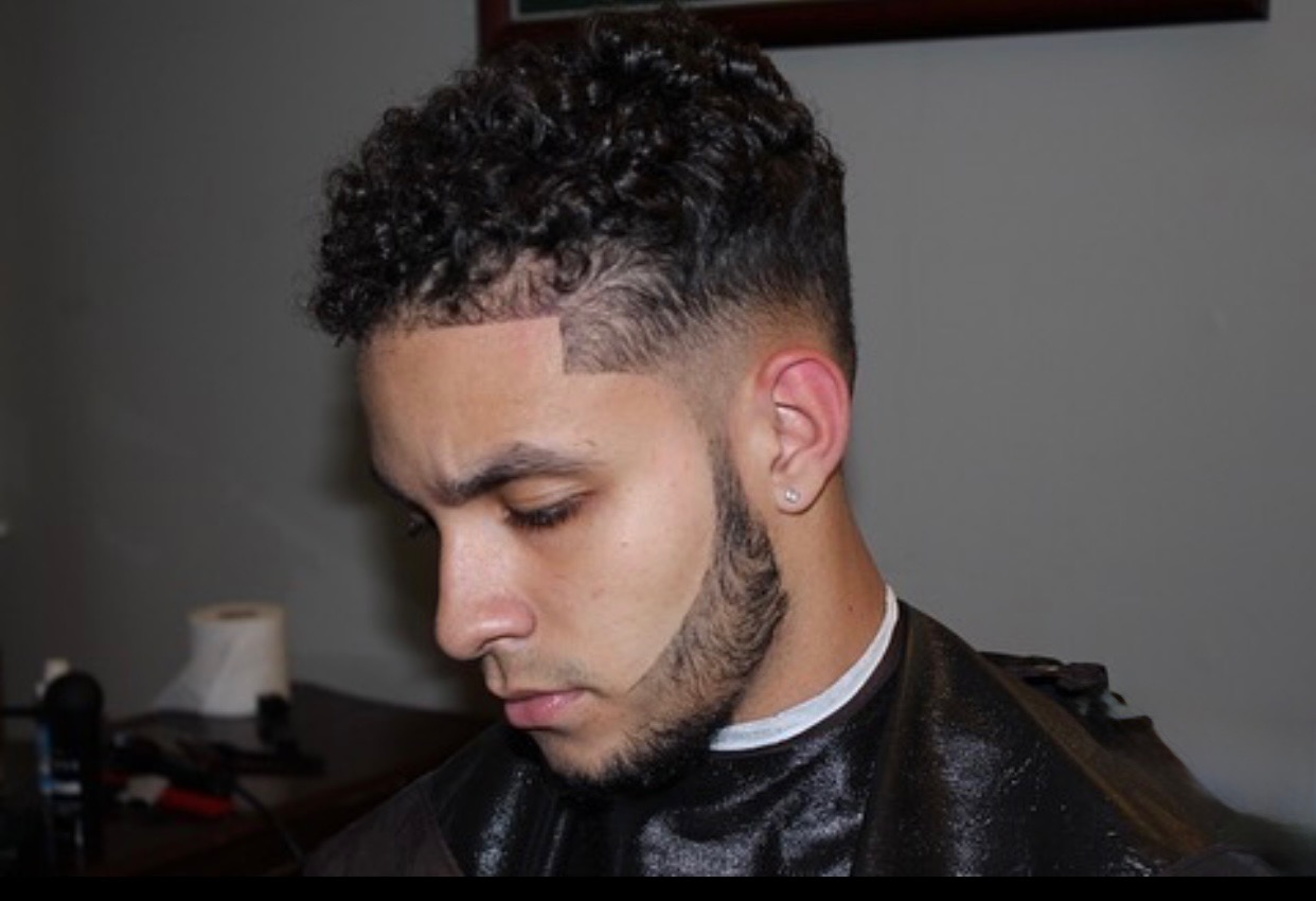 Client with fresh fade and curly top